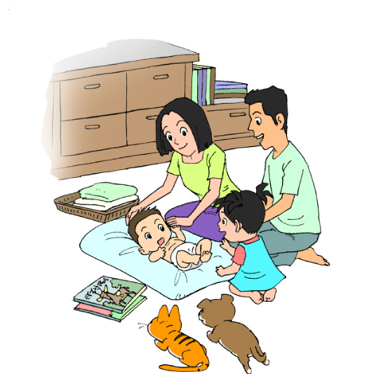 ภาพครอบครัวพ่อ แม่ ลูกคนโตลูกคนเล็ก พร้อมกับหนังสือนิทานวางอยู่ข้างๆ